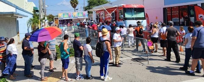 Crowds lined up at the Colgate-Palmolive pavilion at Miami's Calle Ocho festival