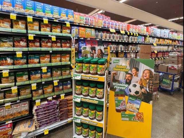 Knorr Winning Flavor cardboard display of bouillon jars at the end of a grocery aisle